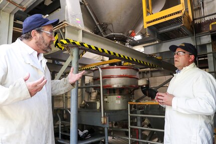 Naval Surface Warfare Center, Indian Head Explosive Ordnance Disposal Technology Division’s (NSWC IHEODTD) Energetics Manufacturing Department Head Ray Geckle (left) explains his department’s function to Naval Surface Warfare Center, Philadelphia Division's Technical Director Thomas Perotti, Sept. 18. (U.S. Navy photo by Matthew Poynor)