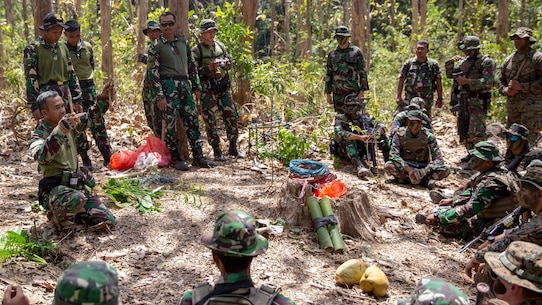 U.S. Marines with Alpha Company, 1st Battalion, 3rd Marine Regiment and Indonesian Marines undergo jungle survival instruction on plants and species that are safe to eat during exercise Korps Marinir (KORMAR) Exchange 2019 in East Java, Indonesia, August 22, 2019. The KORMAR platoon exchange program between Indonesia and the U.S. involves each country sending a platoon of Marines to live and train together at the other's military base. This program enhances the capability of both services and displays their continued commitment to share information and increase the ability to respond to crisis together. (U.S. Marine Corps photo by Cpl. Eric Tso)