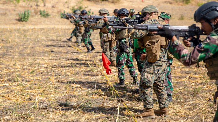 U.S. Marines with Alpha Company, 1st Battalion, 3rd Marine Regiment and Indonesian Marines conduct a live-fire range during exercise Korps Marinir (KORMAR) Exchange 2019 in East Java, Indonesia, August 13, 2019. The KORMAR platoon exchange program between Indonesian and the U.S. involves each country sending a platoon of Marines to live and train together at the other’s military base. This program enhances the capability of both services and displays their continued commitment to share information and increase the ability to respond to crisis together. (U.S. Marine Corps photo by Cpl. Eric Tso)