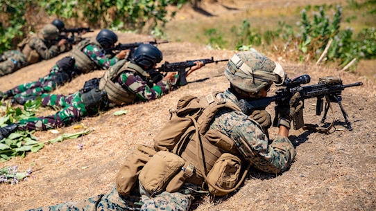 U.S. Marines with 1st Battalion, 3rd Marine Regiment and Indonesian Marines conduct a live-fire range during exercise Korps Marinir (KORMAR) Exchange 2019 in East Java, Indonesia, August 13, 2019. The KORMAR platoon exchange program between Indonesian and the U.S. involves each country sending a platoon of Marines to live and train together at the other’s military base. This program enhances the capability of both services and displays their continued commitment to share information and increase the ability to respond to crisis together. (U.S. Marine Corps photo by Cpl. Eric Tso)