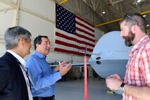 Members of the Defense Innovation Board (DIB) and Defense Digital Services (DDS) talk about the MQ-9 Reaper’s capabilities at a Reaper display at Creech Air Force Base, Nevada, Sept. 12, 2019. During their visit, the DIB, DIU, and DDS members were briefed on possible changes and improvements for the highly-demanded MQ-9 platform. (U.S. Air Force photo by Senior Airman Haley Stevens)