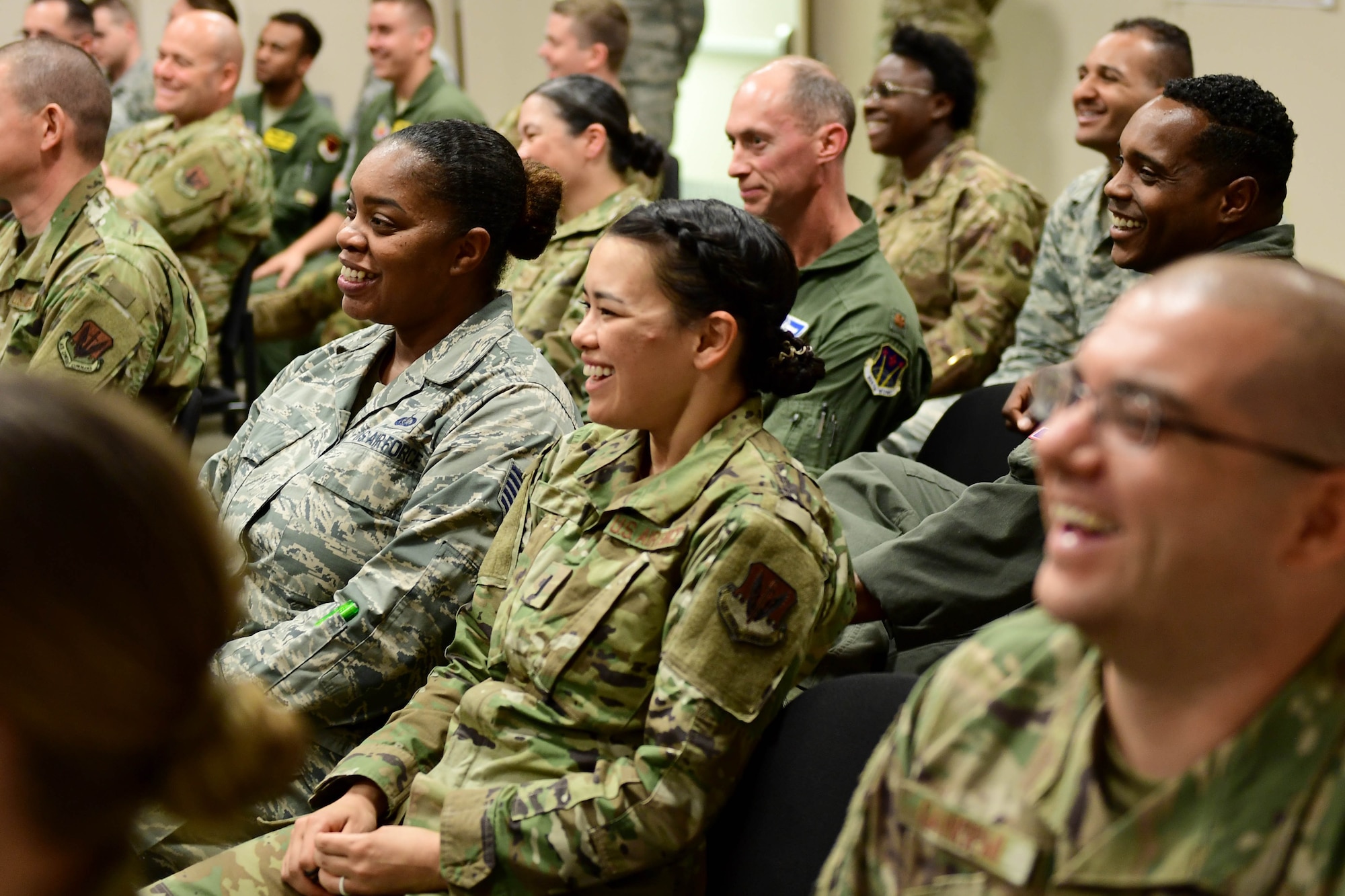 Creech Airmen laugh during a discussion with members of the Defense Innovation Board (DIB), Defense Innovation Unit (DIU) and Defense Digital Services (DDS) at Creech Air Force Base, Nevada, Sept. 12, 2019. As efforts to bring tomorrow’s Air Force faster and smarter continue, 432nd Wing leadership make empowering Airmen to innovate and developing bold leaders top priorities. (U.S. Air Force photo by Senior Airman Haley Stevens)