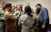 Airmen take photos with Neil Degrasse Tyson, director of the Hayden Planetarium and member of the Defense Innovation Board (DIB), at Creech Air Force Base, Nevada, Sept. 12, 2019. The DIB is made up of prominent business leaders, scholars, entrepreneurs, inventors, scientists and technologists. (U.S. Air Force photo by Senior Airman Haley Stevens)