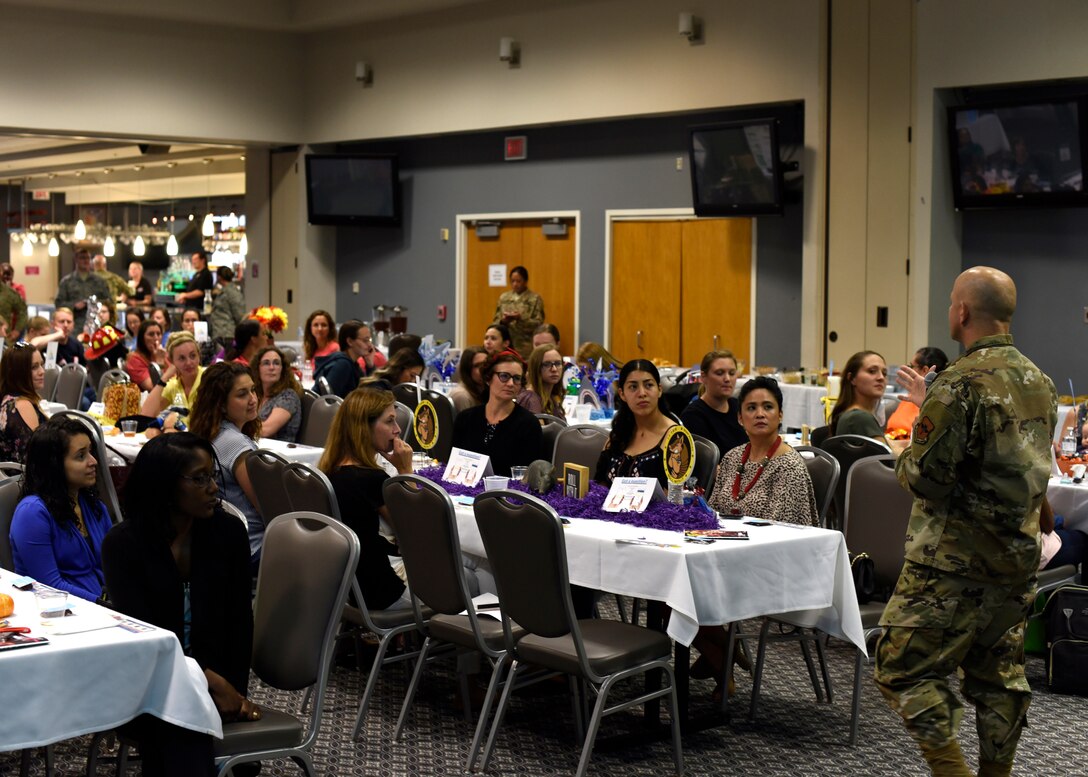 U.S. Air Force Col. Andres Nazario, 17th Training Wing commander, speaks to the spouses during the Spouses Town Hall Social at the event center on Goodfellow Air Force Base, Texas, Sept. 26, 2019. Nazario answered questions from those in attendance and spoke on the important role that the spouses fill. (U.S. Air Force photo by Airman 1st Class Zachary Chapman/Released)