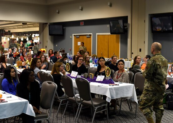 U.S. Air Force Col. Andres Nazario, 17th Training Wing commander, speaks to the spouses during the Spouses Town Hall Social at the event center on Goodfellow Air Force Base, Texas, Sept. 26, 2019. Nazario answered questions from those in attendance and spoke on the important role that the spouses fill. (U.S. Air Force photo by Airman 1st Class Zachary Chapman/Released)