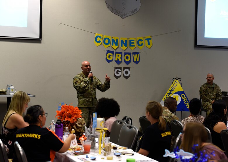 U.S. Air Force Col. Robert Ramirez, 17th Training Wing vice commander, speaks to the spouses during the Spouses Town Hall Social began at the event center on Goodfellow Air Force Base, Texas, Sept. 26, 2019. Ramirez spoke on the mission of Goodfellow and the role that everyone plays to succeed in that mission. (U.S. Air Force photo by Airman 1st Class Zachary Chapman/Released)
