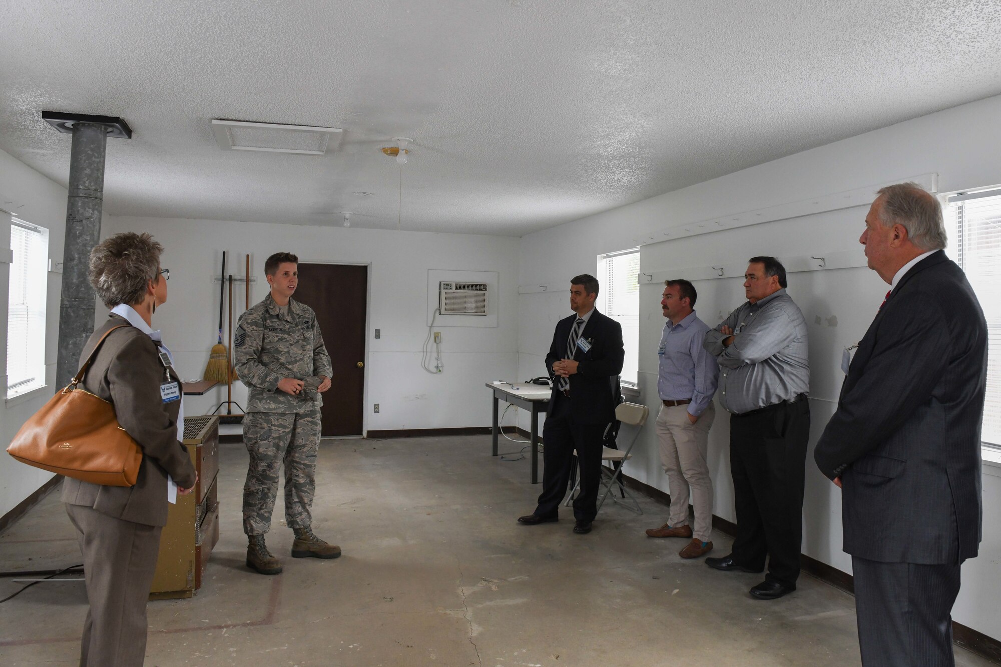 civic leaders stand together in a room