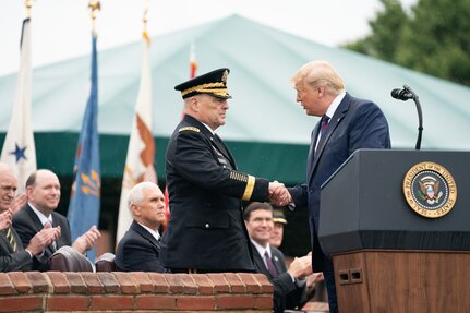 General shakes hands with president.