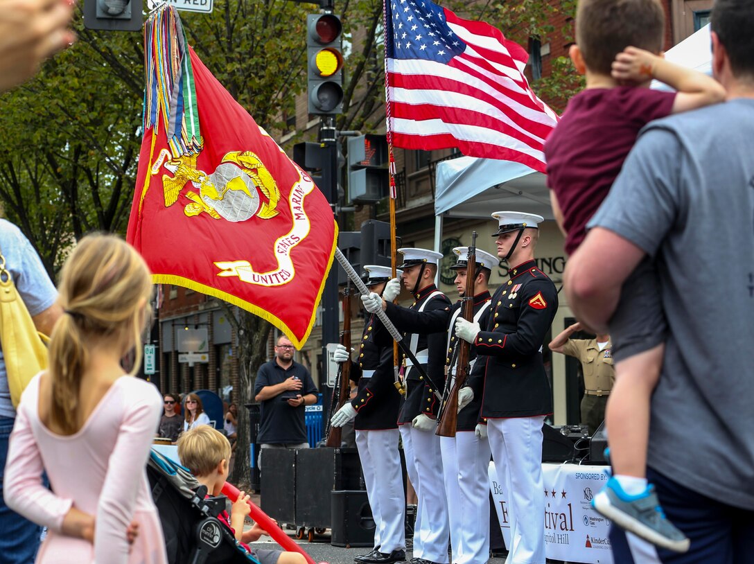 The U.S. Marine Corps Color Guard presents the National Colors during the 2019 Barracks Row Fall Festival in Washington, D.C., Sept. 28, 2019. The annual festival brings the community together to celebrate its rich history and support local venues. (U.S. Marine Corps photo by Sgt. Robert Knapp)