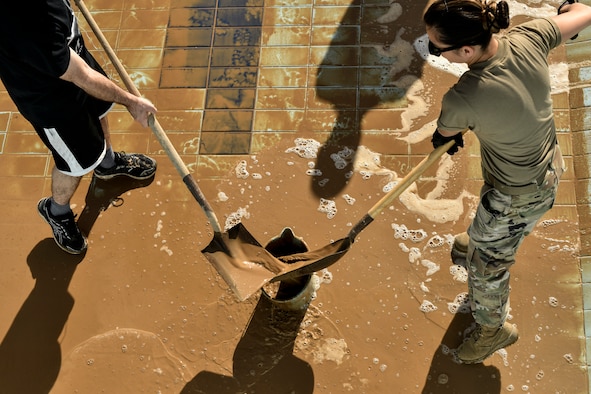 Airmen cleaning pools