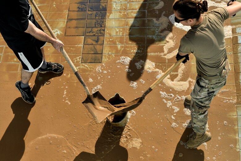 Airmen cleaning pools