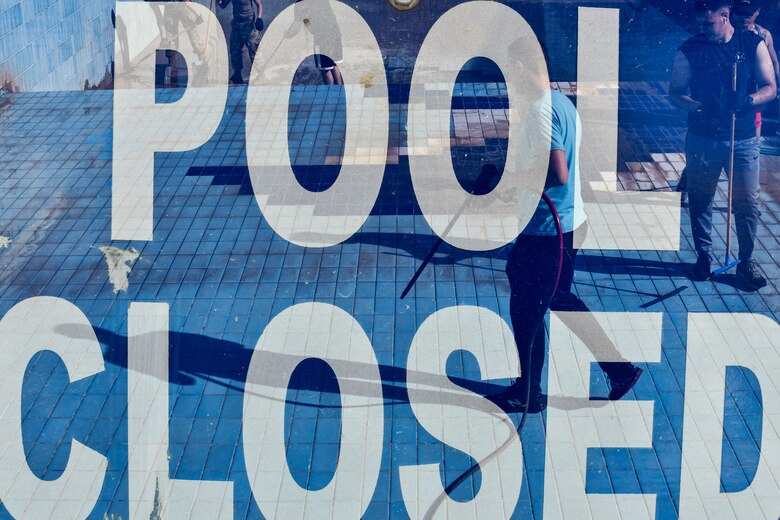 Airmen cleaning pools