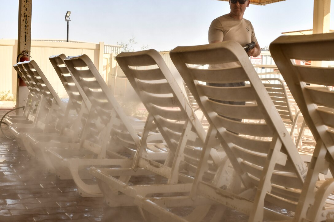 Airmen cleaning pools