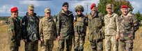Operational capabilities concept evaluators pose for a photo during a walkthrough of a situational training exercise, as part of Rapid Trident 2019, Sept. 19, 2019, near Yavoriv, Ukraine. RT19 is an annual, multinational exercise, which involves approximately 3,700 personnel from 14 nations, that supports joint combined interoperability among partner militaries of Ukraine and the United States, as well as Partnership for Peace nations and NATO allies. (U.S. Army photo by Pfc. Caleb Minor)