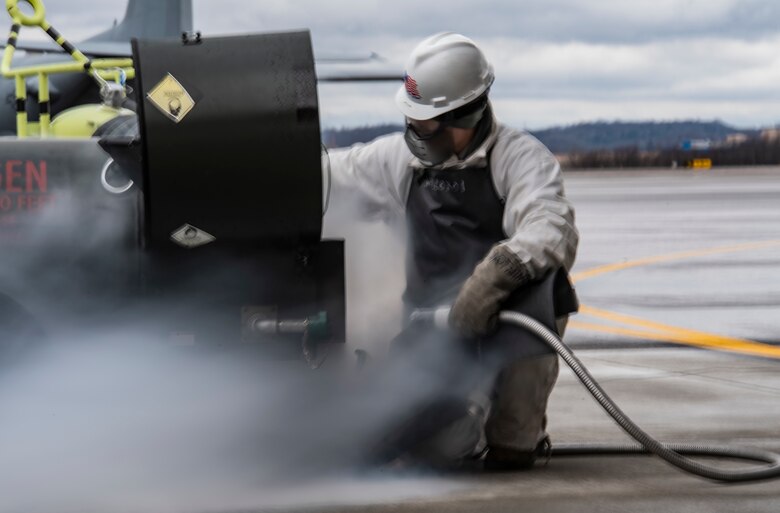 Senior Airman Zachary Anderson, 911th Aircraft Maintenance Squadron crew chief, prepares to service the liquid oxygen of a C-17 Globemaster III at the Pittsburgh International Airport Air Reserve Station, Pennsylvania, March 10, 2020.