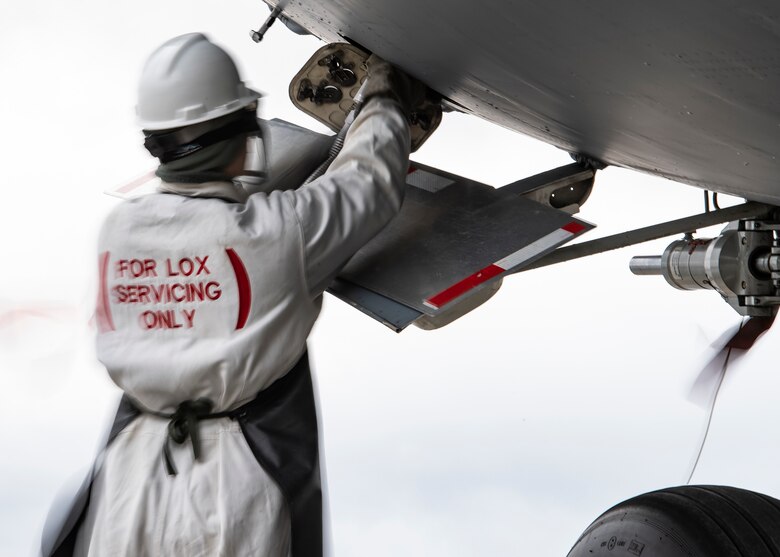 Senior Airman Zachary Anderson, 911th Aircraft Maintenance Squadron crew chief, attaches a liquid oxygen hose to a C-17 Globemaster III at the Pittsburgh International Airport Air Reserve Station, Pennsylvania, March 10, 2020.