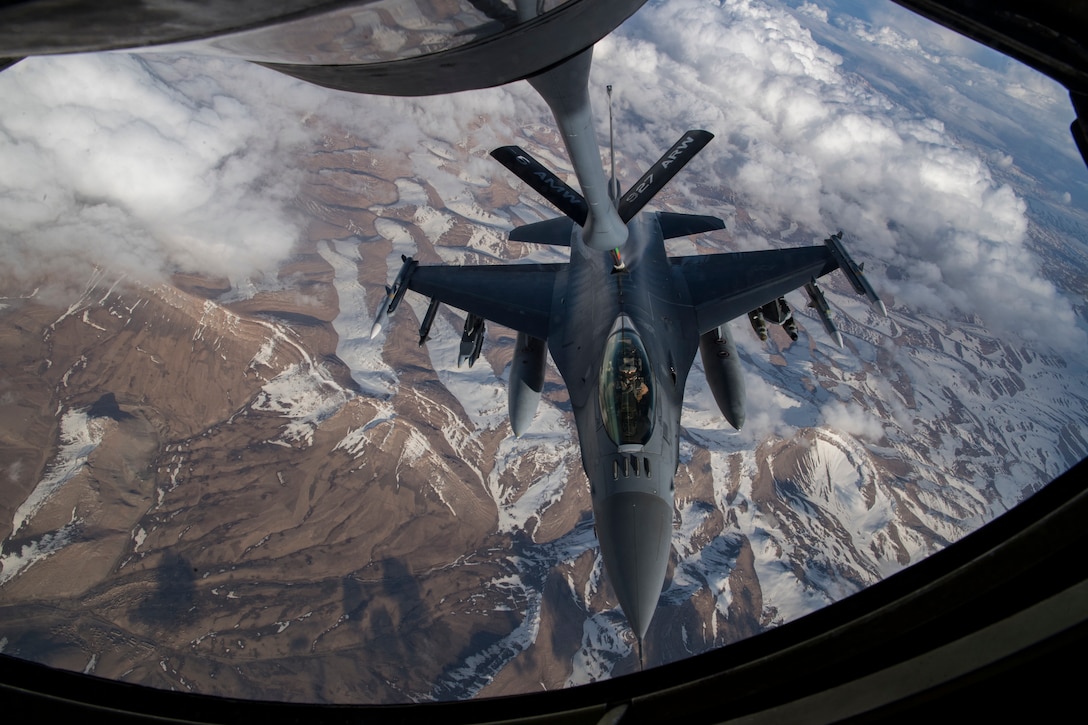 A U.S. Air Force F-16 Fighting Falcon receives fuel from a U.S. Air Force KC-135 Stratotanker assigned to the 28th Expeditionary Air Refueling Squadron over Afghanistan, March 17, 2020. The F-16 Fighting Falcon is a compact, multi-role fighter aircraft that delivers war- winning airpower to the U.S. Central Command area of responsibility. (U.S. Air Force photo by Tech. Sgt. Matthew Lotz)