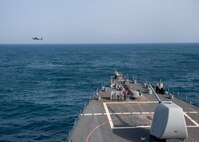 An AH-64 Apache helicopter, attached to U.S. Army Central Command (USARCENT) Task Force Sabre, operates with the guided-missile destroyer USS Paul Hamilton (DDG 60) during a joint naval and air integration operation, March 27, 2020. Paul Hamilton is deployed to the U.S. 5th Fleet area of operations in support of naval operations to ensure maritime stability and security in the Central Region, connecting the Mediterranean and Pacific through the Western Indian Ocean and three strategic choke points.