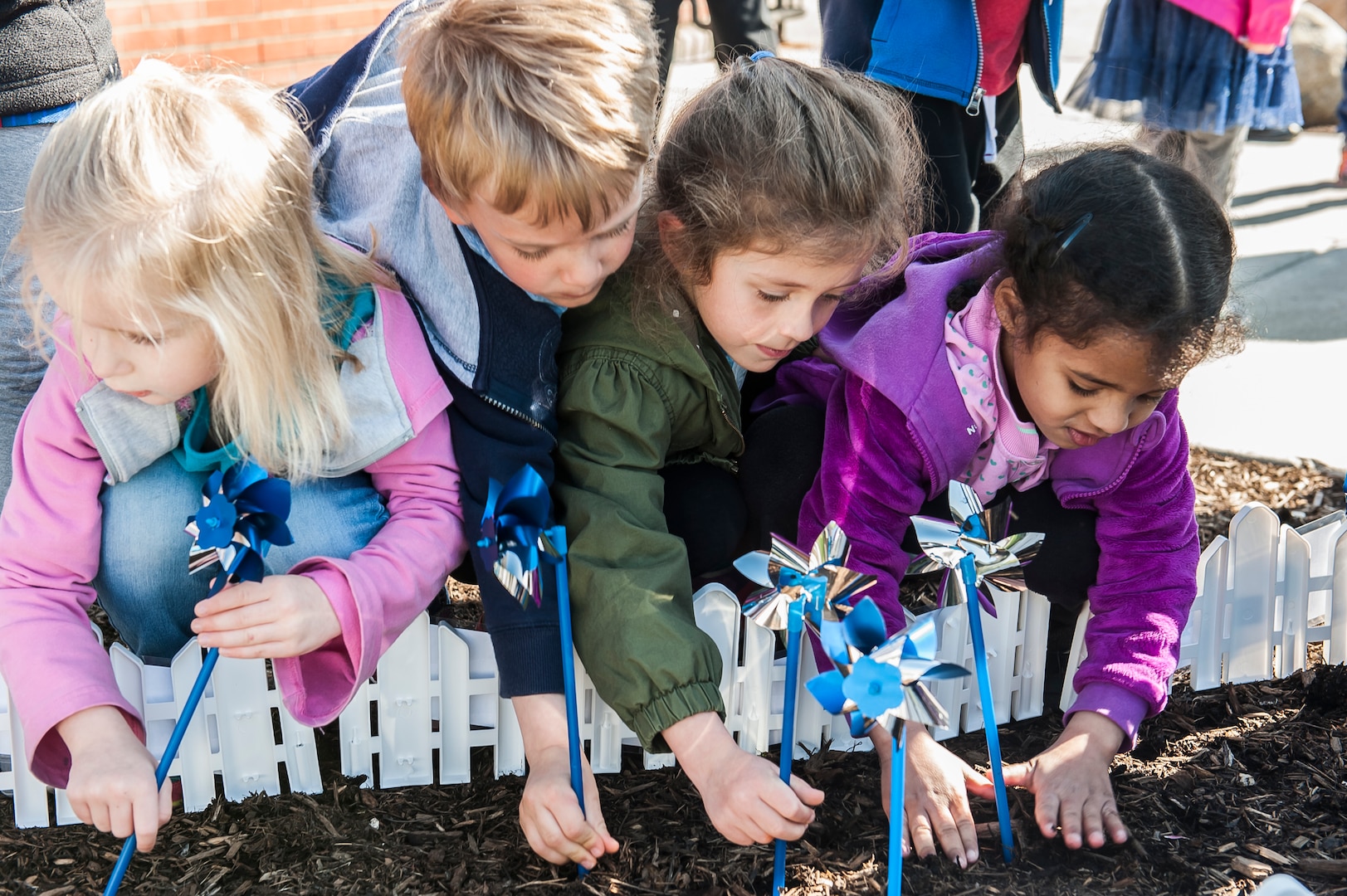 Children plant pinwheels