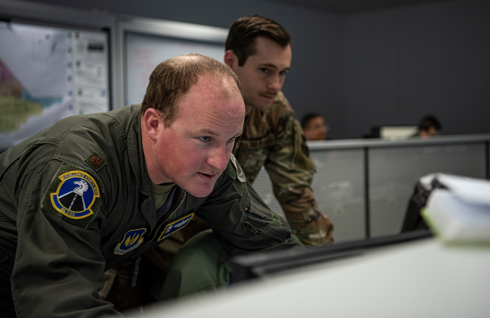 U.S. Air Force Maj. David Mackintosh, 86th Operations Support Squadron, studies information during an Operational Planning Team meeting March 24, 2020.