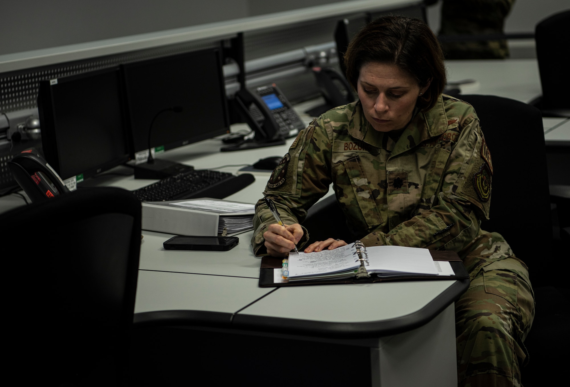 U.S. Air Force Lt. Col. (Dr.) Tracy K. Bozung, 86th Aerospace Medicine Squadron commander, takes notes during an Operational Planning Team meeting at Ramstein Air Base, Germany, March 24, 2020.