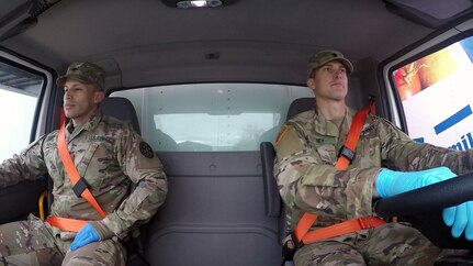 California Army National Guard’s Spcs. Jose Hurtado and Dylan Ney prepare to roll out a food truck March 31, 2020, at the Sacramento Food Bank & Family Services’ distribution outlet in Sacramento, California. After weeks of COVID-19 humanitarian support, Guard members are adding to their responsibilities by serving as truck drivers, delivering food to the public.