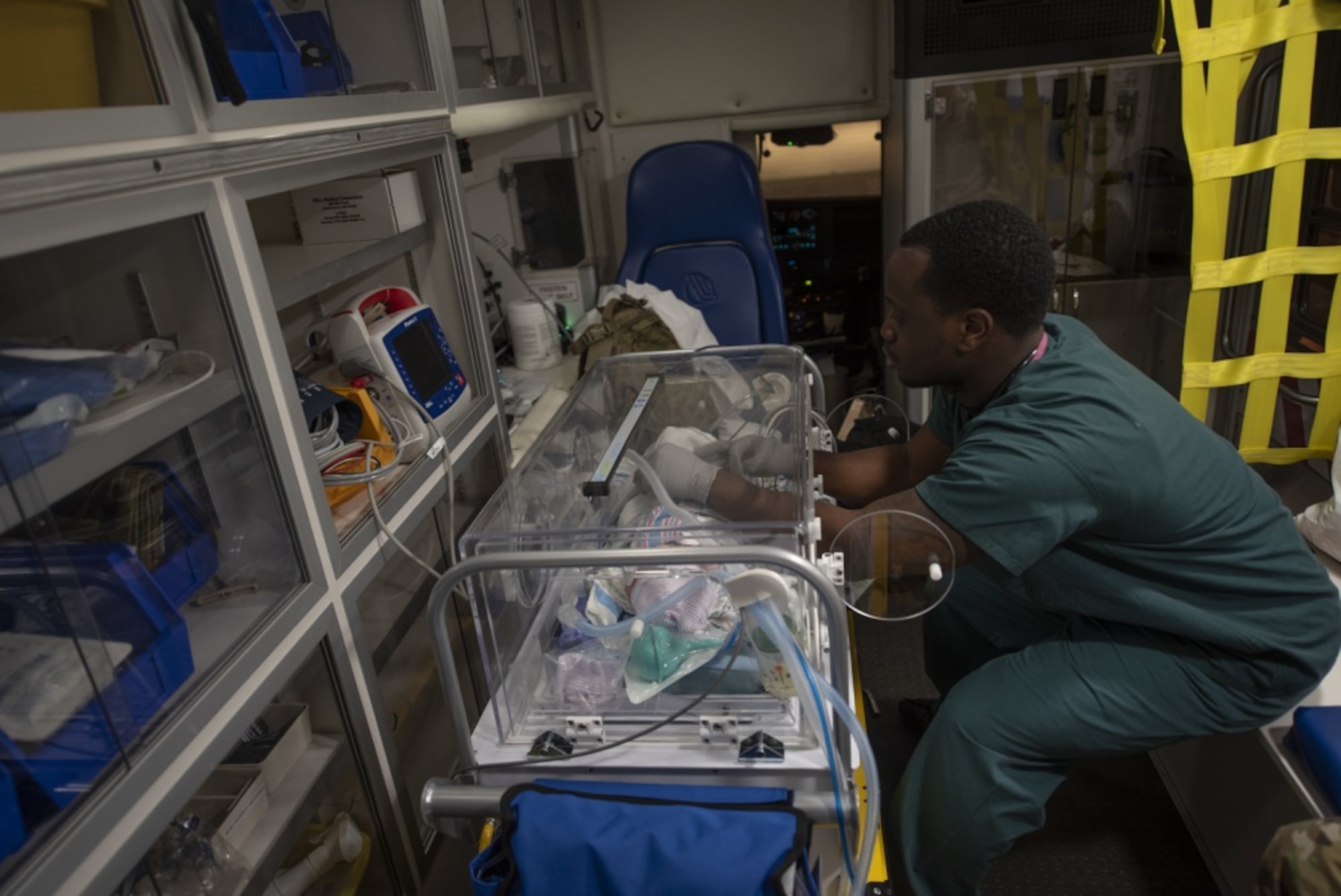 Pacific Air Force’s Airmen and Soldiers transload newborn twins onto a C-17 Globemaster III during an aeromedical evacuation mission, March 30, 2020, at Osan Air Base, Republic of Korea.