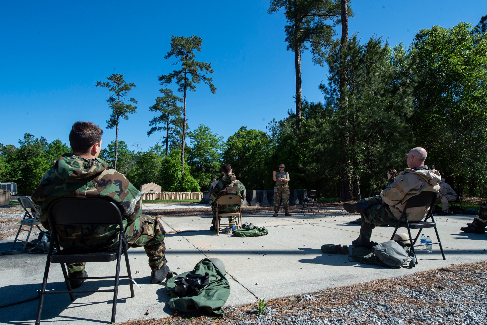 Photo of Airmen attending a chemical, biological, radiological, and nuclear defense training.