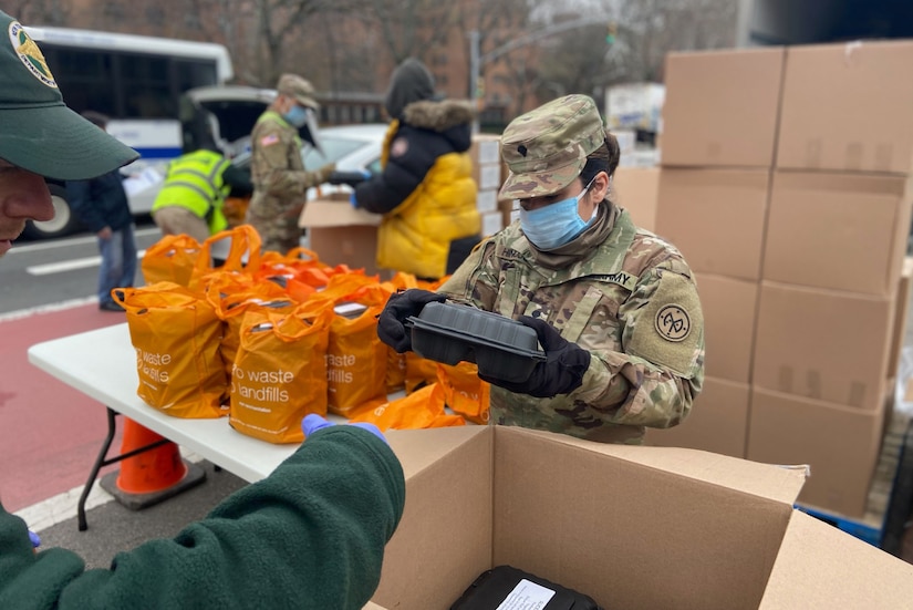 A soldiers packs reusable bags