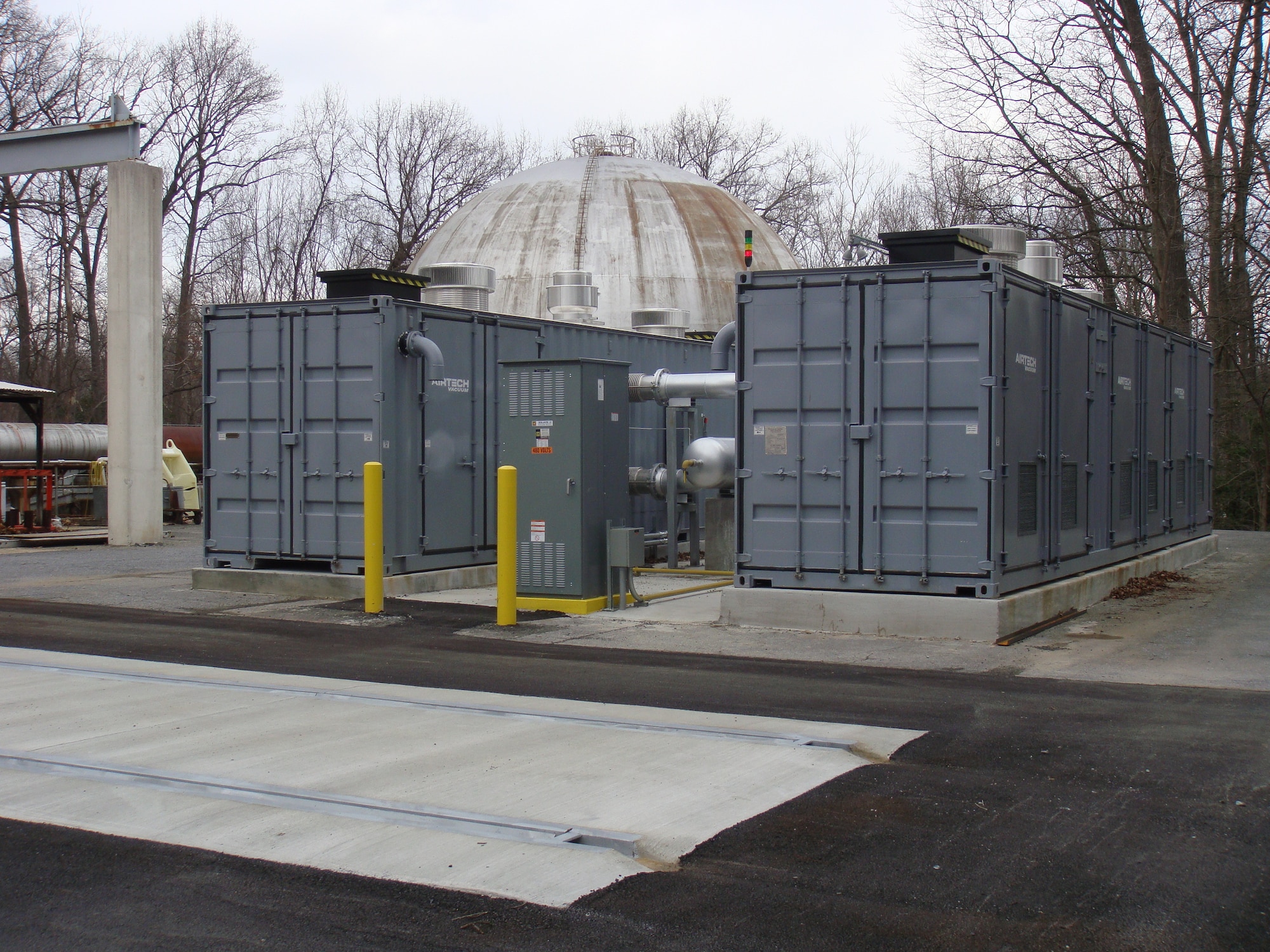 The Containerized Vacuum System (CVS) is now in place at Arnold Engineering Development Complex Hypervelocity Wind Tunnel 9 in White Oak, Maryland. The primary purpose of the CVS is to reduce the pressure in the 200,000 cubic foot Tunnel 9 Vacuum Sphere, pictured in the background, to levels at which test operations can be performed. Tunnel 9 personnel moved forward with the installation of the CVS after one of the compressors in the Tunnel 9 Vacuum Compressor Plant went down and required repairs. (U.S. Air Force photo by Nicholas Fredrick)