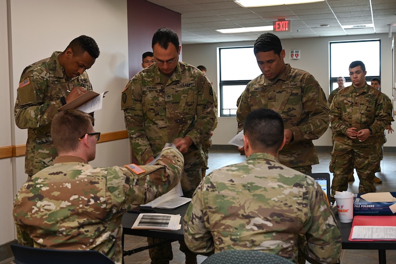 Soldiers assigned to the Connecticut Army National Guard, Bravo Company, 1st Battalion, 102nd Infantry Regiment prepare for a mission at the Middletown Armed Forces Reserve Center, March 31, 2020, Middletown, Connecticut. The soldiers were placed on State Active Duty orders in response to the COVID-19 pandemic. (U.S. Air National Guard photo by Tech. Sgt. Tamara R. Dabney)