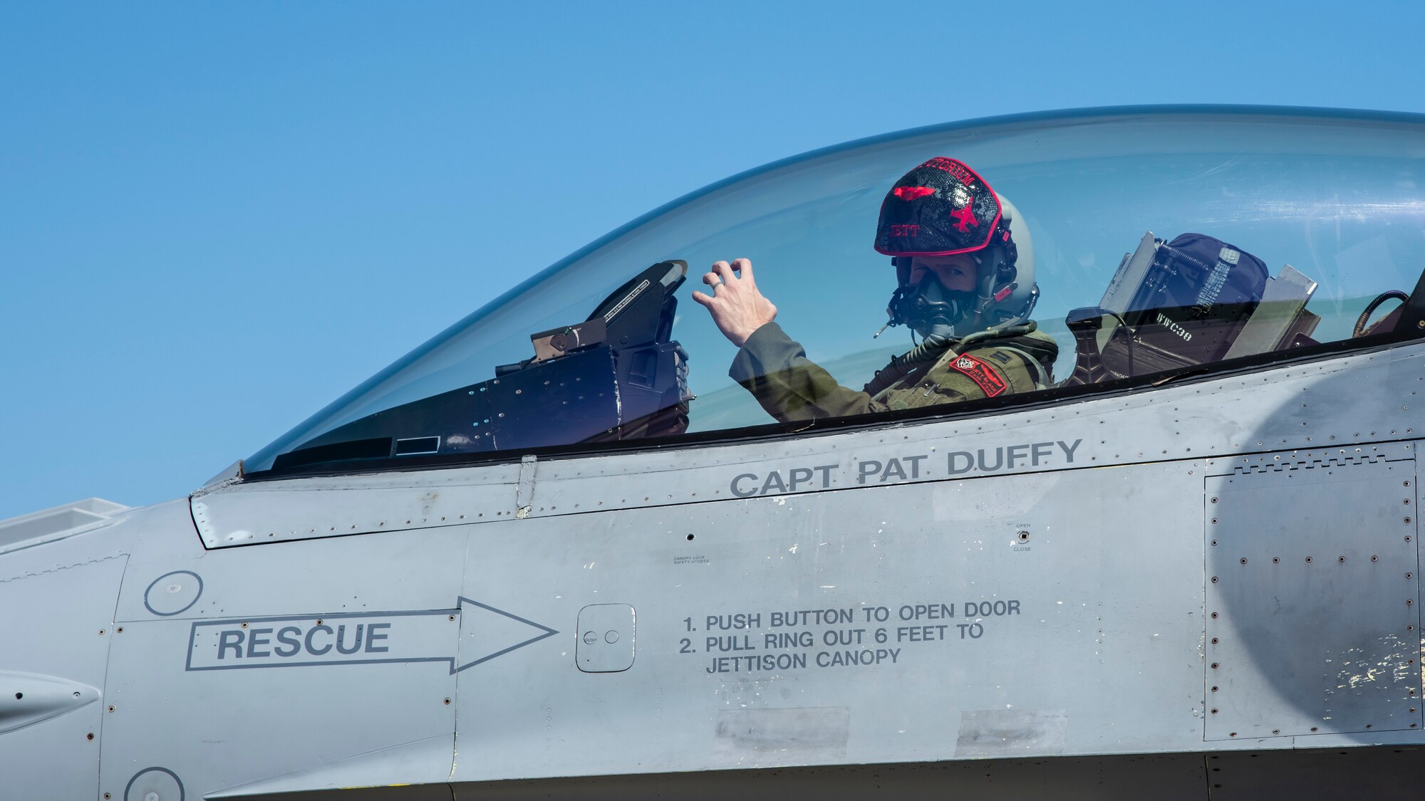 U.S. Air Force Capt. Reese Black, a 13th Fighter Squadron F-16 Fighting Falcon pilot and chief of mobility, throws up the “panther paw” at Misawa Air Base, Japan, March 30, 2020. Airmen with the 13th FS and 13th Aircraft Maintenance Unit display the “panther paw” hand sign as homage to Eldridge, the 13th Tactical Fighter Squadron’s pet panther, during the Vietnam War, now represented as the official mascot of the 13th FS. (U.S. Air Force photo by Airman 1st Class China M. Shock)