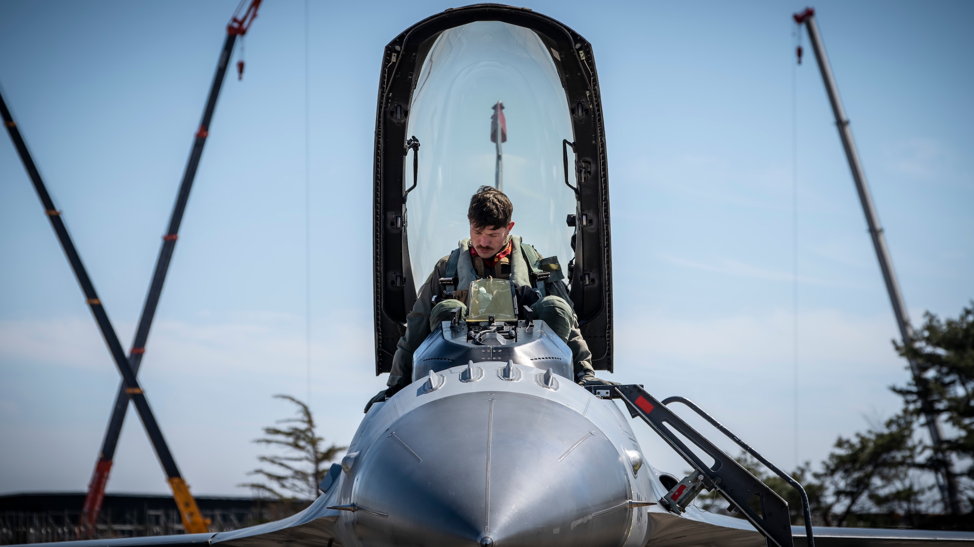 U.S. Air Force Capt. Taylor Dickins, a 13th Fighter Squadron F-16 Fighting Falcon pilot and squadron flight safety officer, sits in the cockpit of an F-16 at Misawa Air Base, Japan, March 30, 2020. Established as the 313th Bombardment Squadron during World War II, the 13th FS pioneered the Wild Weasel mission during the Vietnam War. In 1972, the 13th FS adopted a black Asian leopard named Eldridge and became known as the “Panther Pack.” On June 1, 1985, the squadron activated at Misawa Air Base flying for the 432nd and 35th Operations Groups. (U.S. Air Force photo by Airman 1st Class China M. Shock)