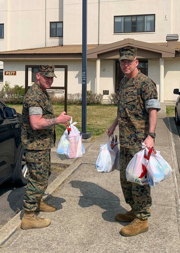Marines from MARFORK hand out care packages for Marines.