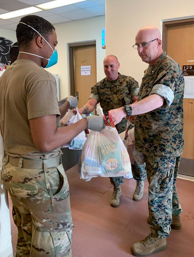 Marines from MARFORK distribute care packages for Marines.