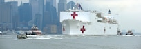 Coast Guard assets, along with New York Police Department and New York Fire Department assets, provide a security escort for the USNS Comfort arrival into New York Harbor, March 30, 2020