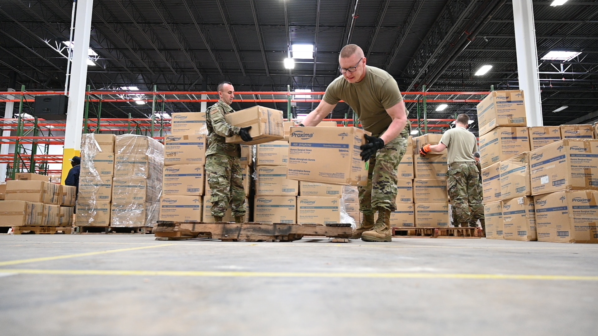 U.S. Air Force Tech. Sgt. Bradly Tuthill, left, and U.S. Air Force Master Sgt. Richard Malloy, ground transportation specialists with the 175th Logistics Readiness Squadron, Maryland Air National Guard, prepare and load boxes of medical supplies and equipment March 19, 2020, at the Maryland Strategic National Stockpile. The Maryland Guard has shipped more than 1 million items to health care workers and hospitals across the state.