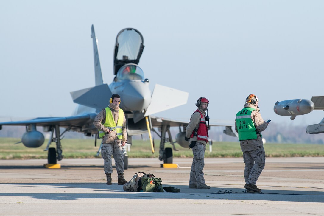 Spanish Airmen prepare Eurofighter Typhoons for take-off, March 26, 2020, at Dover Air Force Base, Delaware. The U.S Air Force and it’s Air Mobility Command welcome the opportunity to support our international partners and Allies as they respond to impacts of the COVID-19 pandemic. Dover Air Force Base hosted more than a dozen aircraft as they return to their home countries following the cancellation of Exercise Red Flag at Nellis AFB, Nevada. Through intense internal coordination and in collaboration with interagency partners, all of the affected aircraft have been approved to redeploy to their host nations. Dover continues to prioritize the safety of our service members and community as we support the safe return of our NATO partners.  (U.S. Air Force photo by Mauricio Campino)
