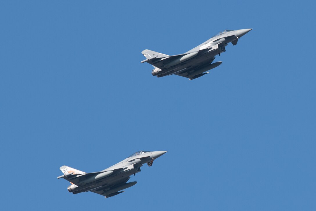 A pair of Eurofighter Typhoons take off, March 26, 2020, at Dover Air Force Base, Delaware. The U.S Air Force and it’s Air Mobility Command welcome the opportunity to support our international partners and Allies as they respond to impacts of the COVID-19 pandemic. Dover Air Force Base hosted more than a dozen aircraft as they return to their home countries following the cancellation of Exercise Red Flag at Nellis AFB, Nevada. Through intense internal coordination and in collaboration with interagency partners, all of the affected aircraft have been approved to redeploy to their host nations. Dover continues to prioritize the safety of our service members and community as we support the safe return of our NATO partners.  (U.S. Air Force photo by Mauricio Campino)