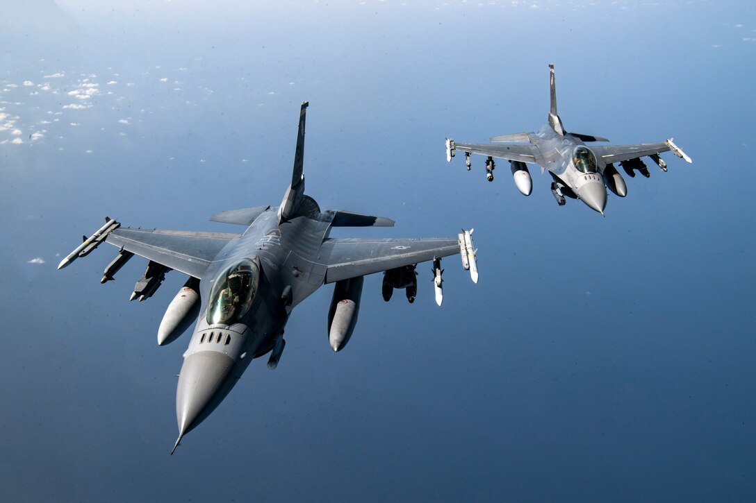 Two U.S. Air Force F-16 Fighting Falcons fly over Afghanistan, March 17, 2020. The F-16 Fighting Falcon is a compact, multi-role fighter aircraft that delivers war- winning airpower to the U.S. Central Command area of responsibility. (U.S. Air Force photo by Tech. Sgt. Matthew Lotz)
