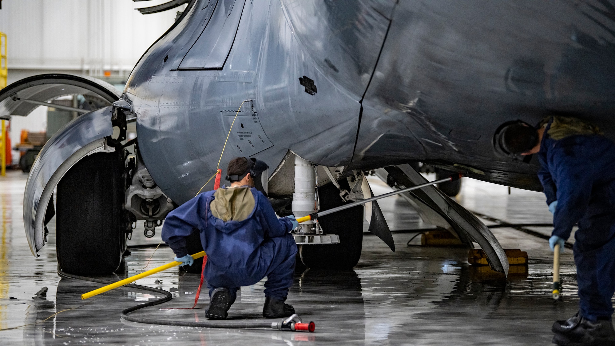 Reserve Citizen Airmen assigned to the 445th Maintenance Group wash a C-17 Globemaster III here March 27, 2020.