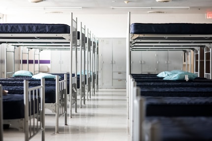 Spread out bunks in Air Force dormitory.