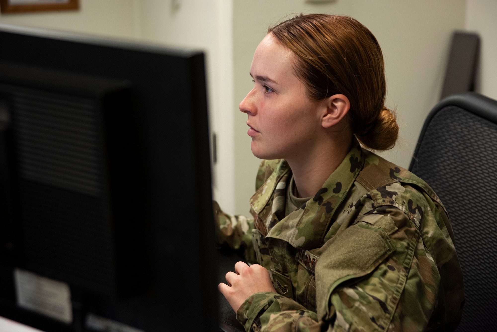 Senior Airman Paige Reasons, 30th Comptroller Squadron financial operations technician, provides virtual customer service support March 24, 2020, at Vandenberg Air Force Base, Calif. To prevent the spread of COVID-19, the 30th CPTS closed the customer service area and turned to an online approach to ensure their military and contracting customers received the support they need. (U.S. Air Force photo by Airman 1st Class Hanah Abercrombie)