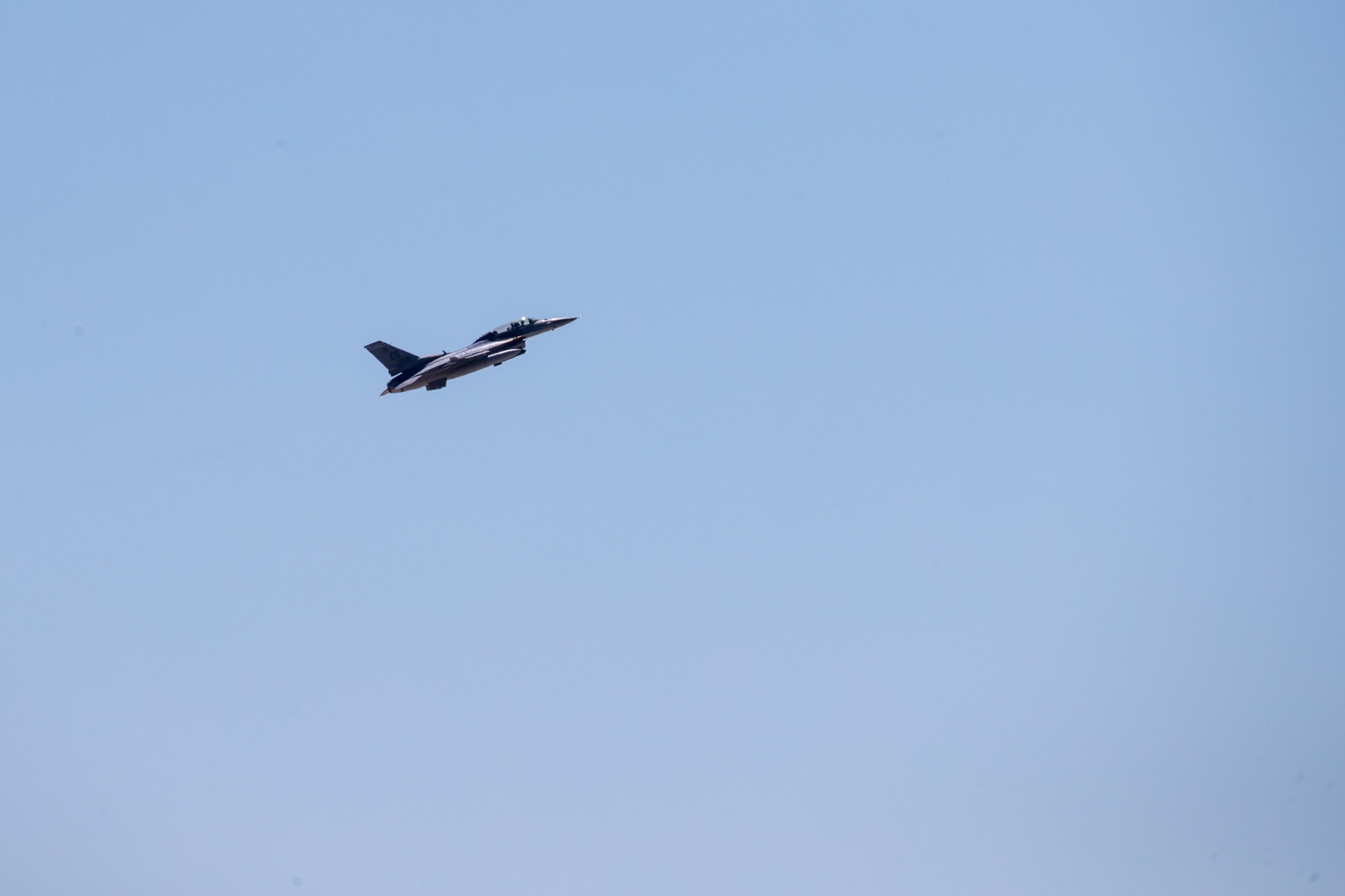 An F-16 Fighting Falcon flies in the skies above Edwards Air Force Base, California, April 1. The jet conducted a flight test sortie with other jets from its sister squadrons. (Air Force photo by Kyle Brazier)