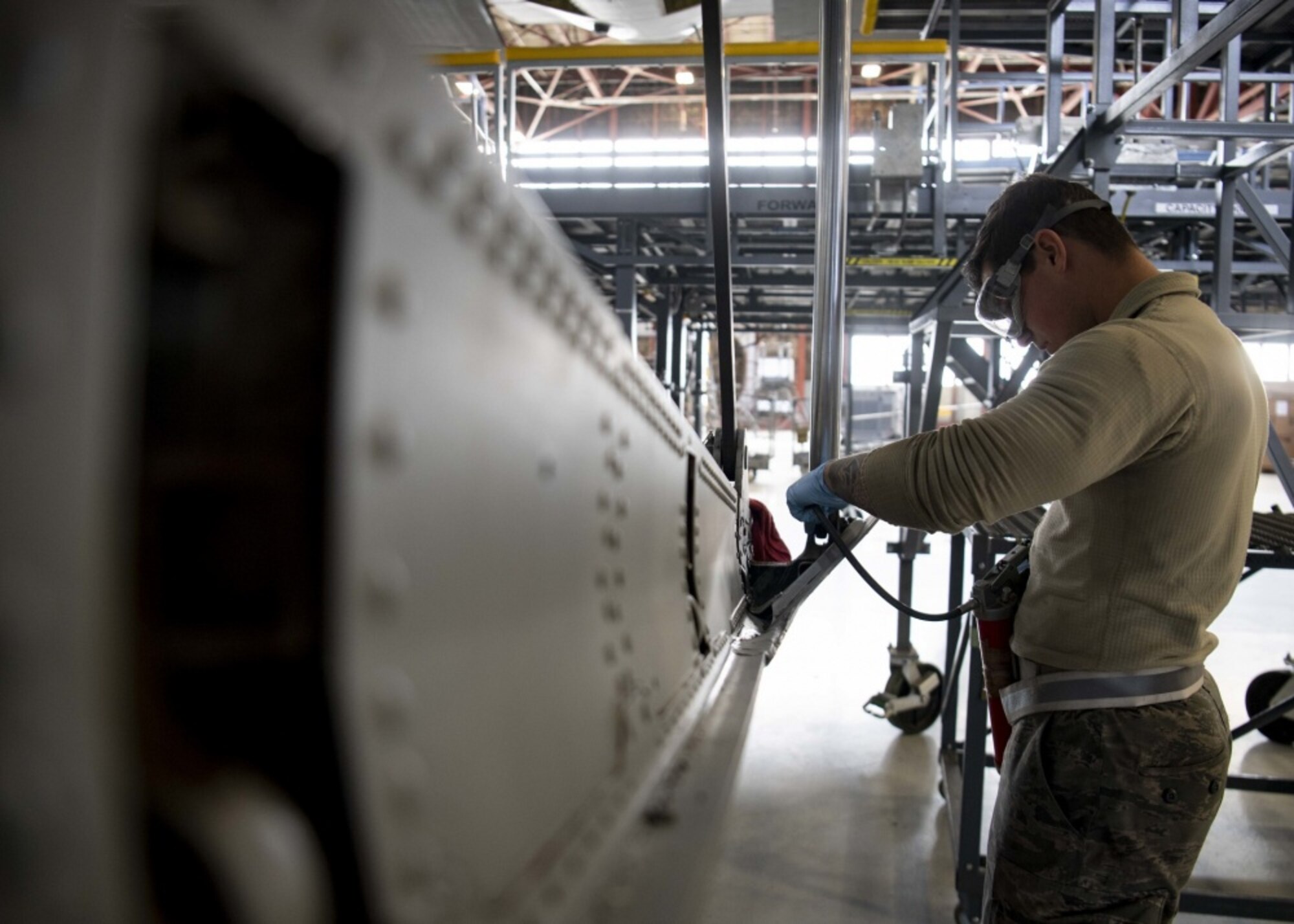 An Airmen works on an aircraft