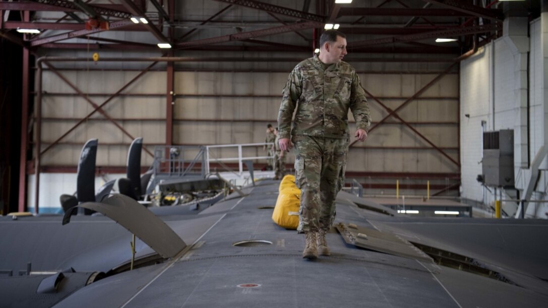Airmen work on an aircraft