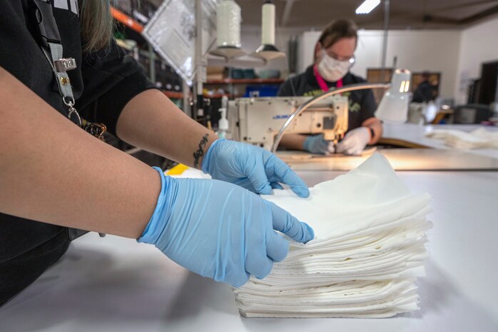 Shop 64 fabric workers at Puget Sound Naval Shipyard & Intermediate Maintenance Facility in Bremerton make cloth masks and polycarbonate face shields that can be used to protect the workforce, or provided to Naval Hospital Bremerton and local hospitals if the need arises.