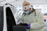 Medical technician writes down information.