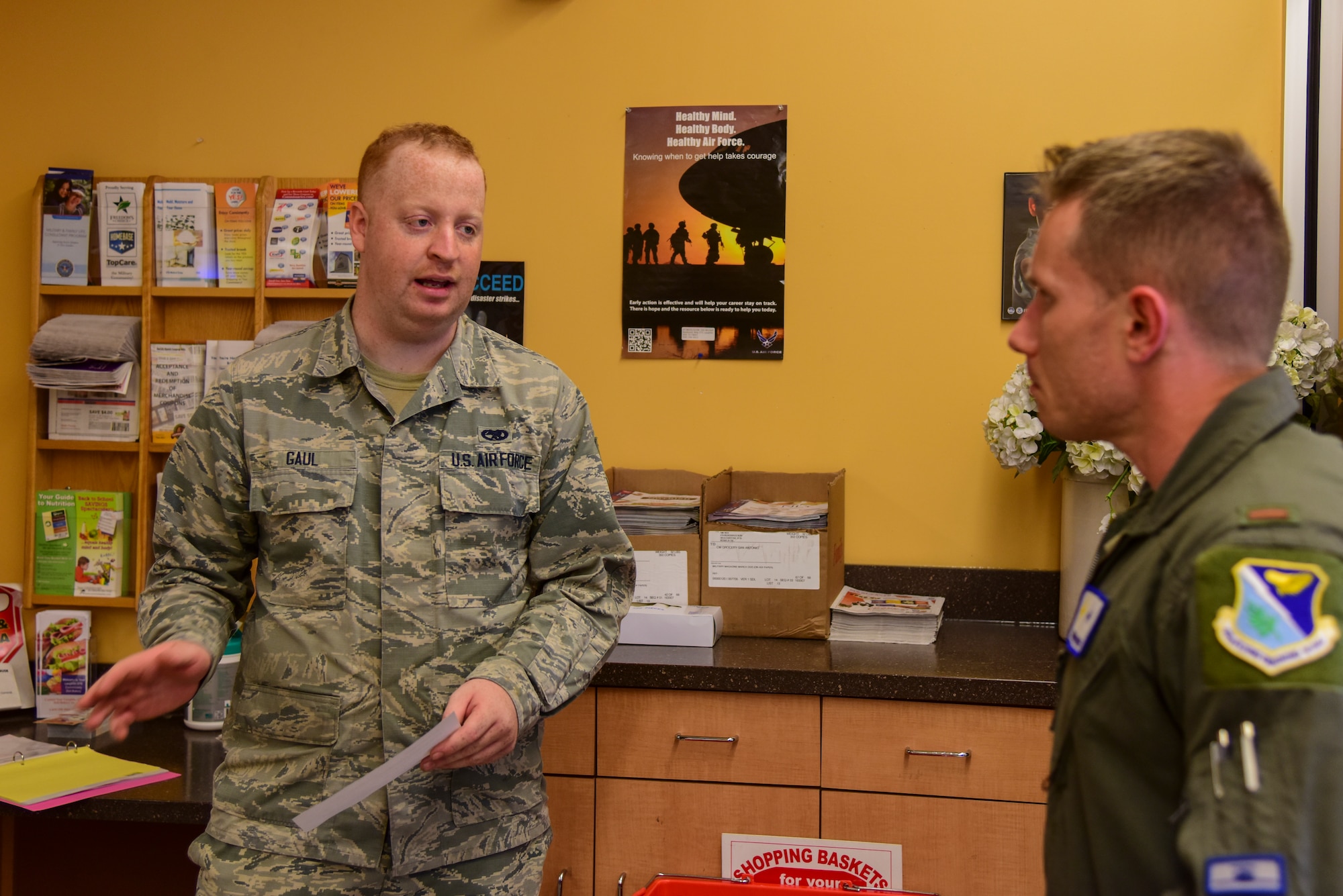 Senior Airman Jackson Gaul, 47th Flying Training Wing Wing Staff Agencies egress journeyman, assists the commissary employees by checking identification and ensures only 25 customers are in the store at any given time on March 31, 2020 at the commissary at Laughlin Air Force Base, Texas. According to an article by DeCA Corporate Communications, commissaries and its support facilities have been designated mission-critical as part of the Department of Defense during COVID-19. (U.S. Air Force photo by Senior Airman Anne McCready)