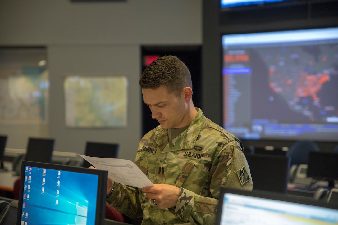 CPT Spencer Diamond of the USACE Philadelphia District reviews mission details in Smyrna, DE on Mar. 27 during response operations to the COVID-19 public health emergency. 

USACE is providing initial planning and engineering support to address possible medical facility shortages due to the COVID-19 Pandemic as part of a nationwide federal, state and local effort to respond to the public health emergency.